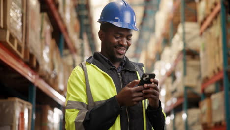 warehouse worker using cellphone