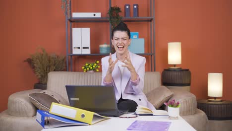 home office worker young woman having a nervous breakdown.