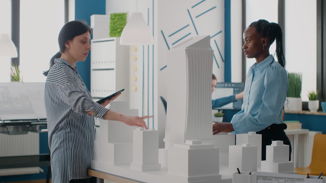 Architects working on a building model in the office