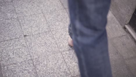 barefoot on a tiled street