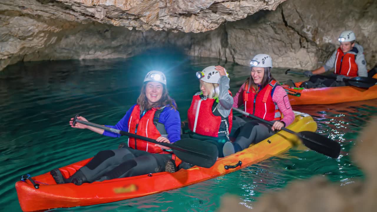 Women surprised and smile during Mine Kayak Tour, Mezica, Slovenia