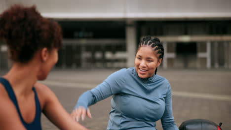 two women celebrating a workout