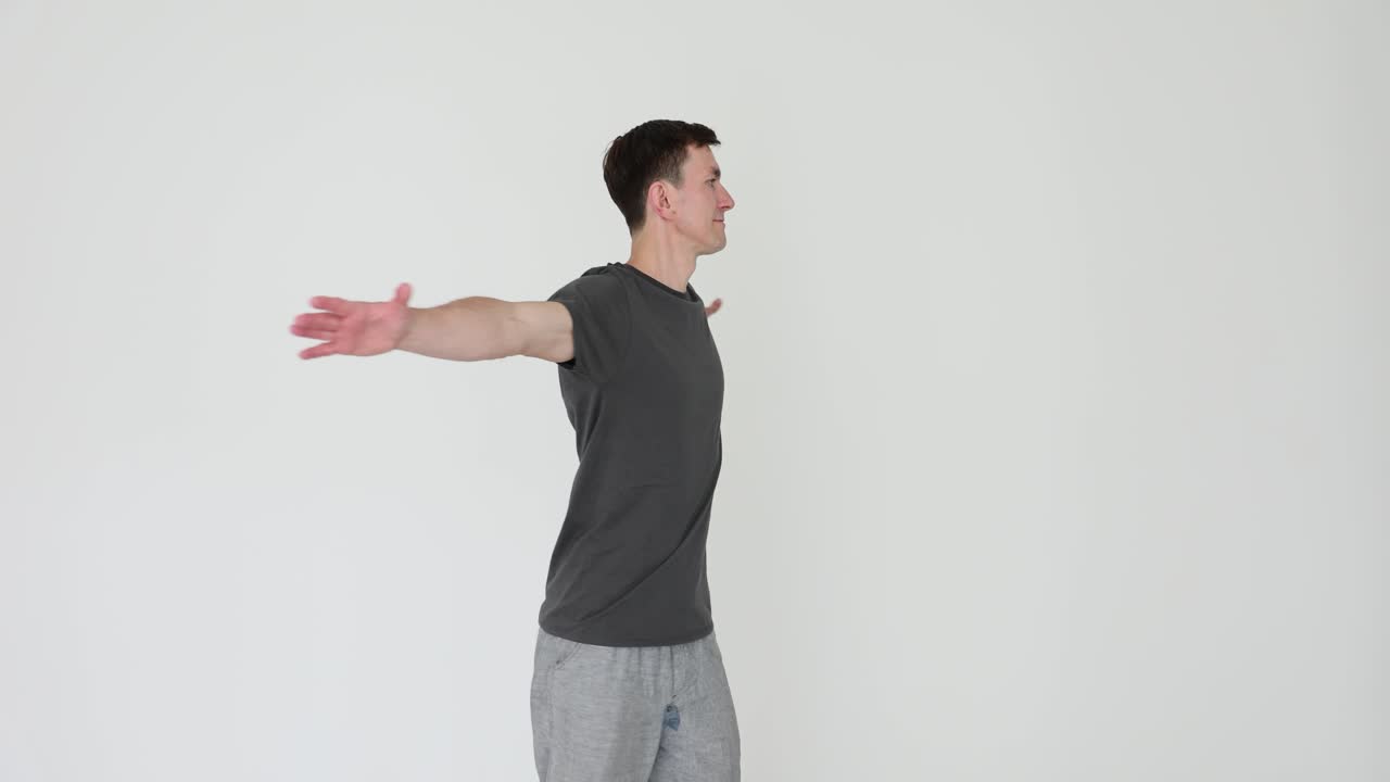 Man performing outstretched arm exercise