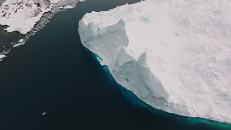 drone over sea and ice of ilulissat icefjord