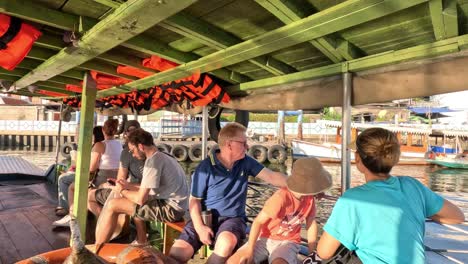 passengers enjoying a boat tour on a river