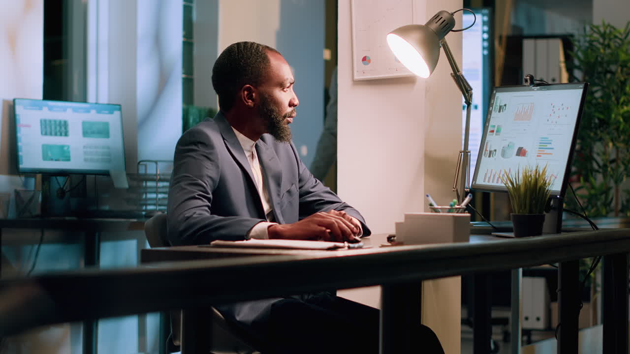 Man Working at Desk with Computer