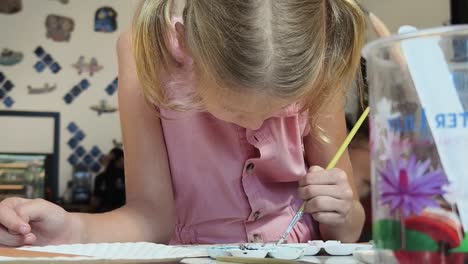 girl painting at a painting class