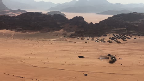 vehicle and bedouin camp tents in wadi rum desert, jordan