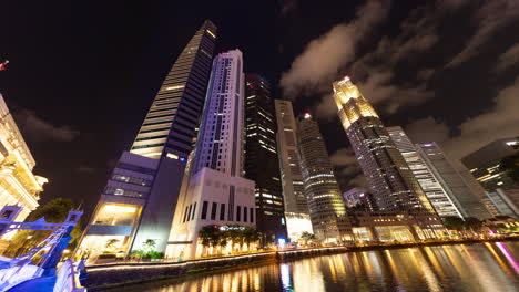 singapore - 5 march 2025 : timelapse of the singapore central business district skyline reflected in the river at night