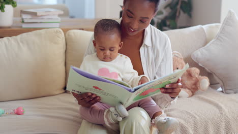 mother reading book to baby