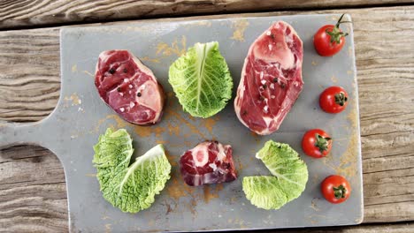 marinated steak and vegetables on chopping board