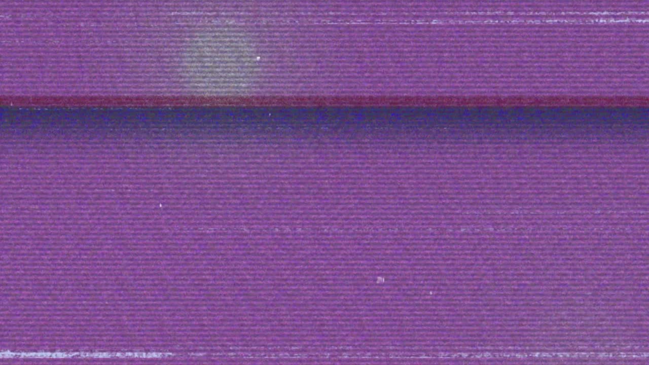 Animation of glitch interference over glowing spots on purple background