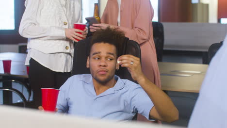 man talking with an colleague at the office party