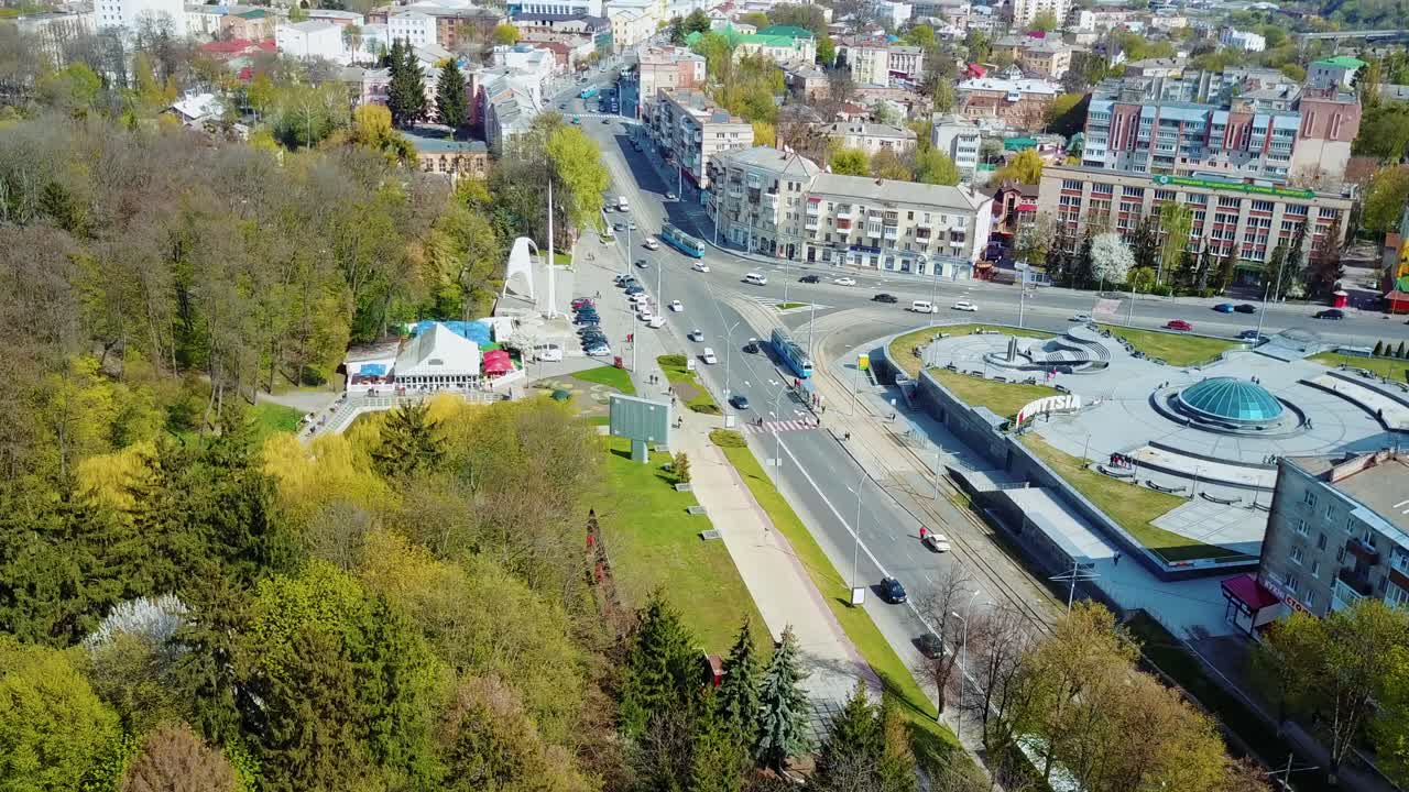 Aerial view of the city center. Aerial city view with crossroads, roads, houses, buildings, parks