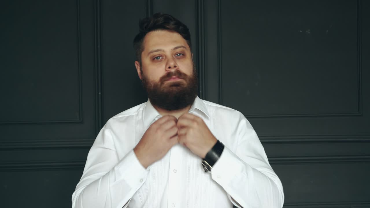 Young bearded man. Brutal caucasian serious handsome man in studio