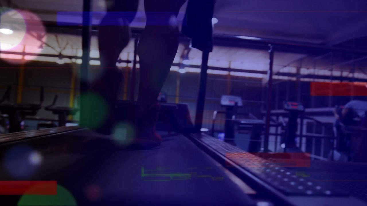 Animation of multicolored lines and lens flares over low section of man running on treadmill in gym