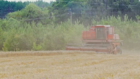 Combine harvester in action on the field. Combine harvester. Harvesting machine for harvesting a wheat field.