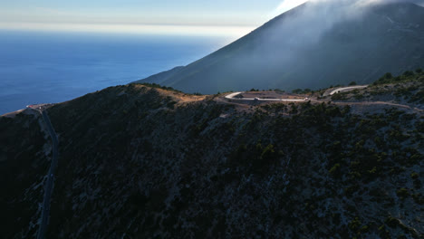 Drone-rising-and-rotating-over-the-Llogara-mountain-pass,-sunny-day-in-Albania