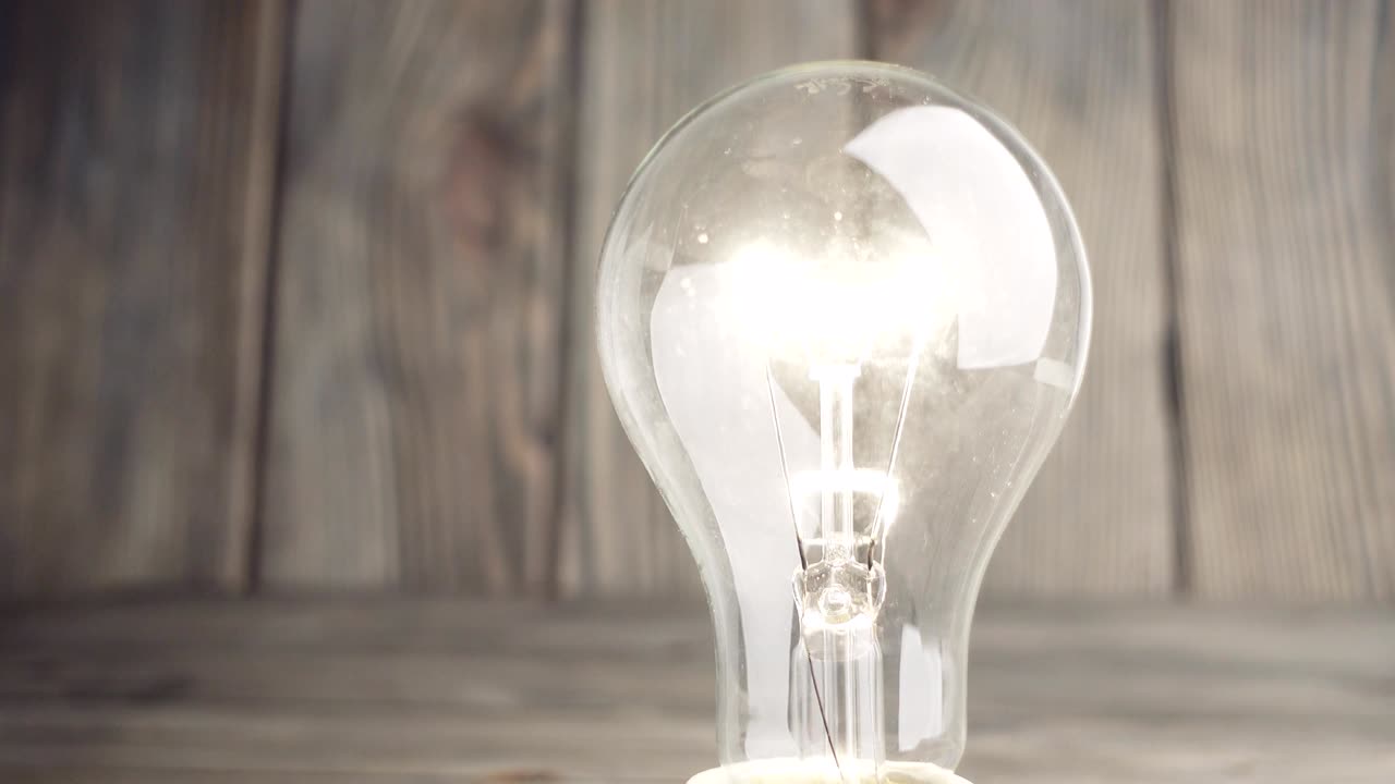 Light bulb on wood background