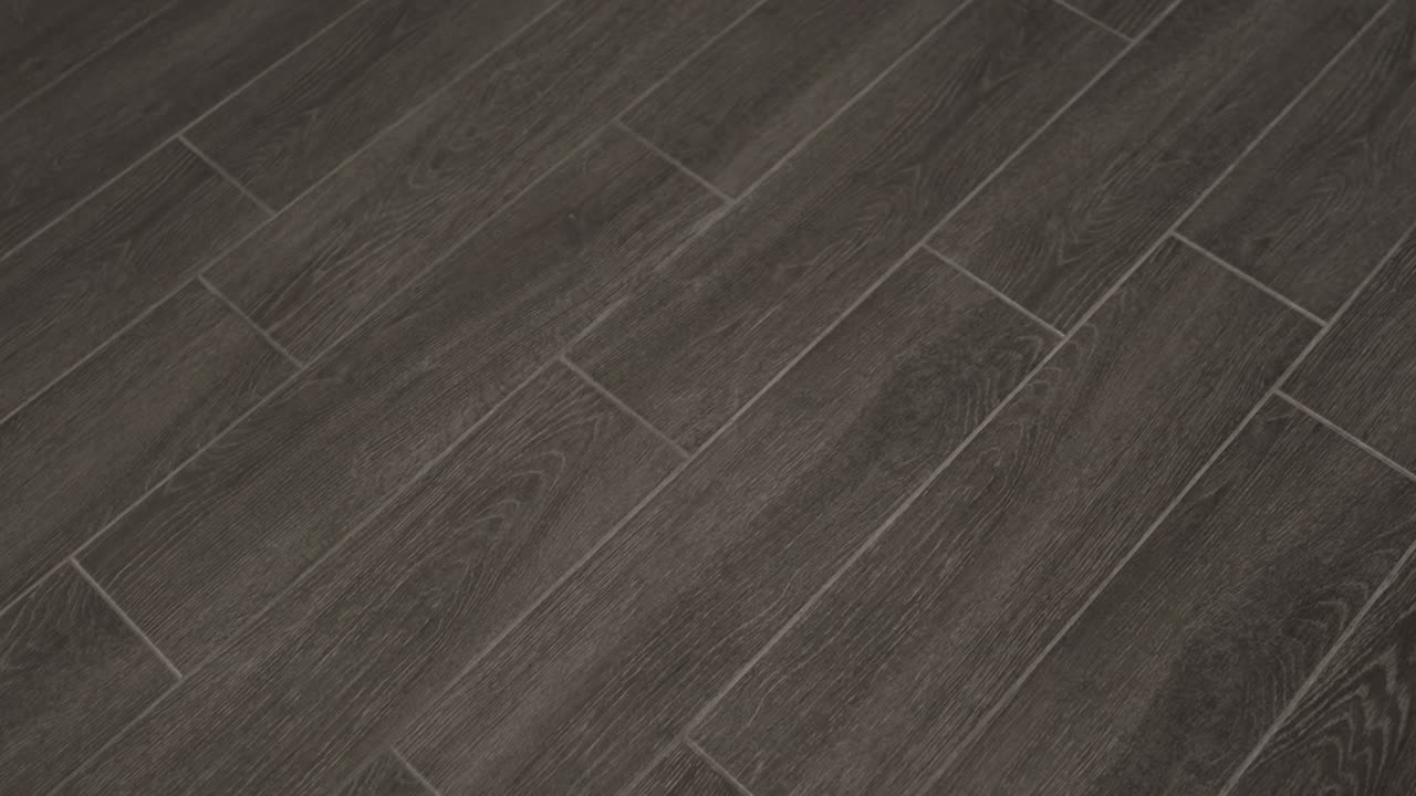Ceramic or porcelain long floor tiles in dark gray color