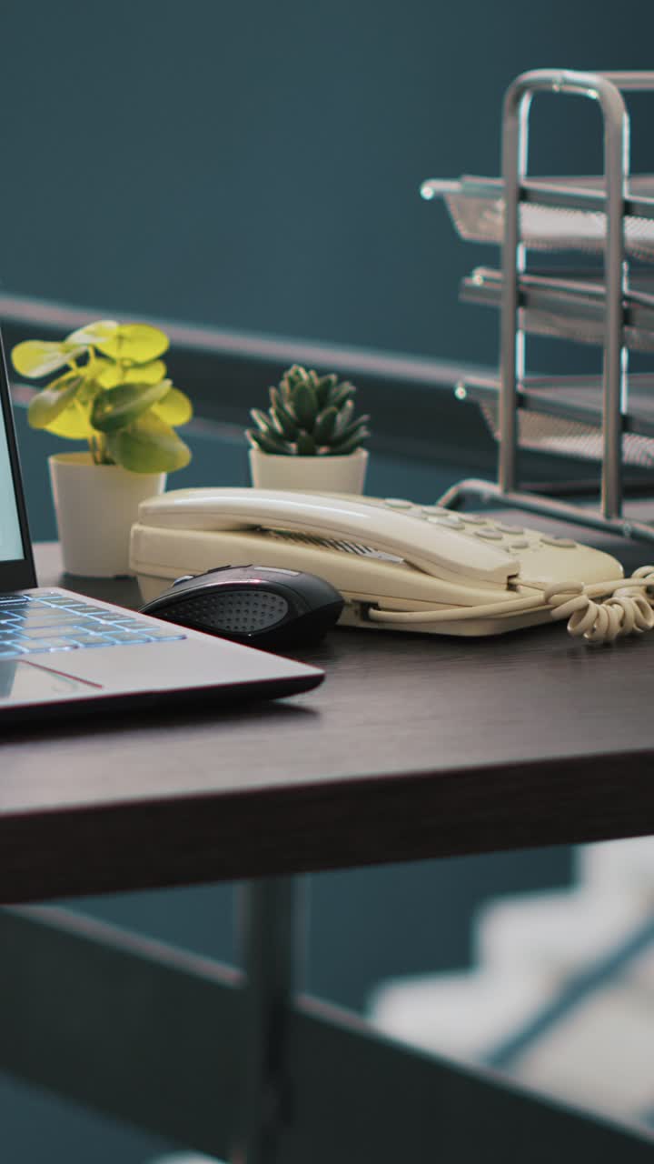 Vertical video Wheelchair in inclusive office and laptop showing marketing report data