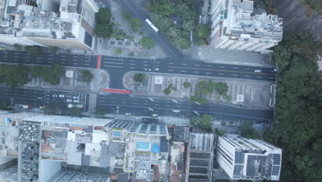 top down, aerial time-lapse of the streets coming out of the tunnel in a copacabana beach in rio de janeiro brazil