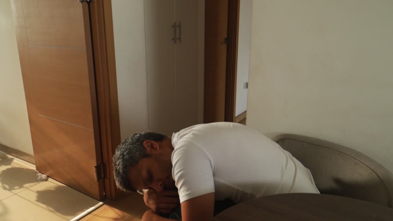 Man sitting in a chair indoors