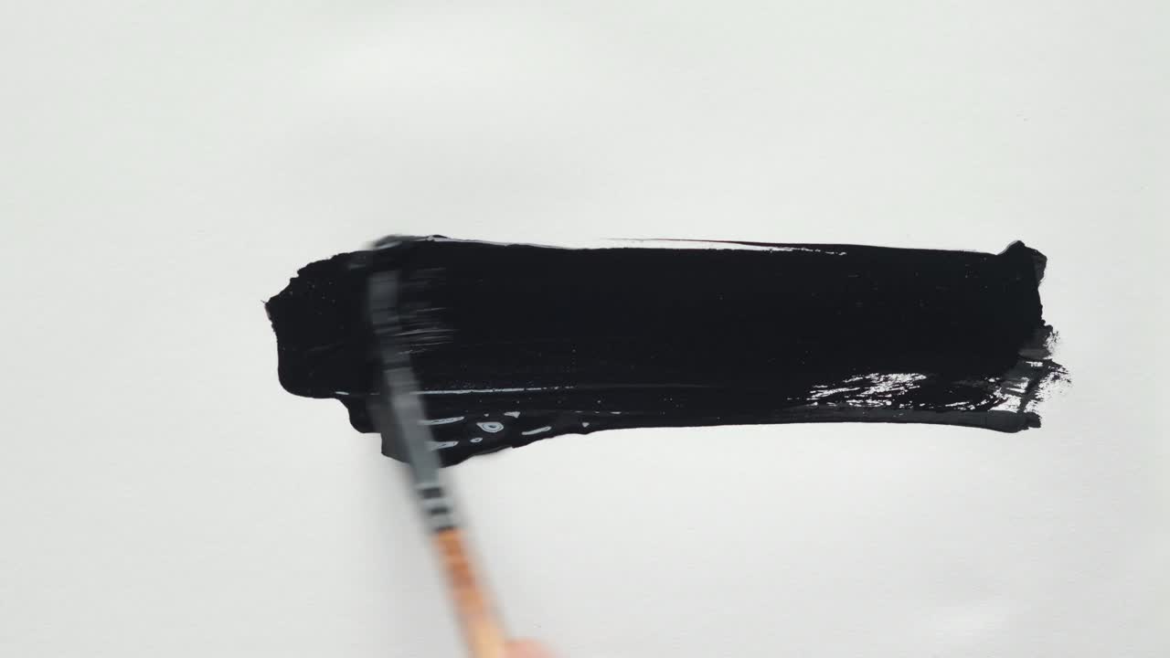 Black Paint Strokes on White Paper