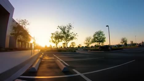 sunrise or sunset over commercial parking lot