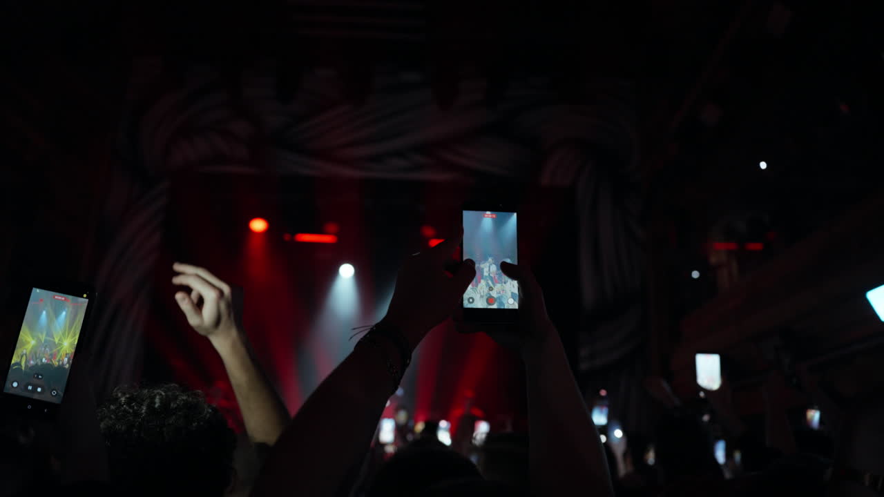 Audience Members Recording Live Concert on Smartphones