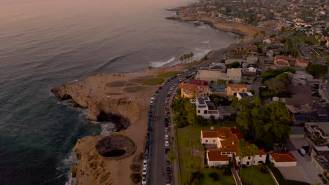 Flying-over-the-open-ceiling-sea-cave-at-Sunset-Cliffs-Natural-Park-in-Point-Loma,-San-Diego-California