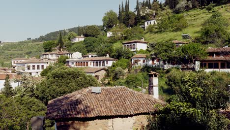 View-over-Turkish-mountain-village-of-Sirince-rooftops-with-smoking-chimney