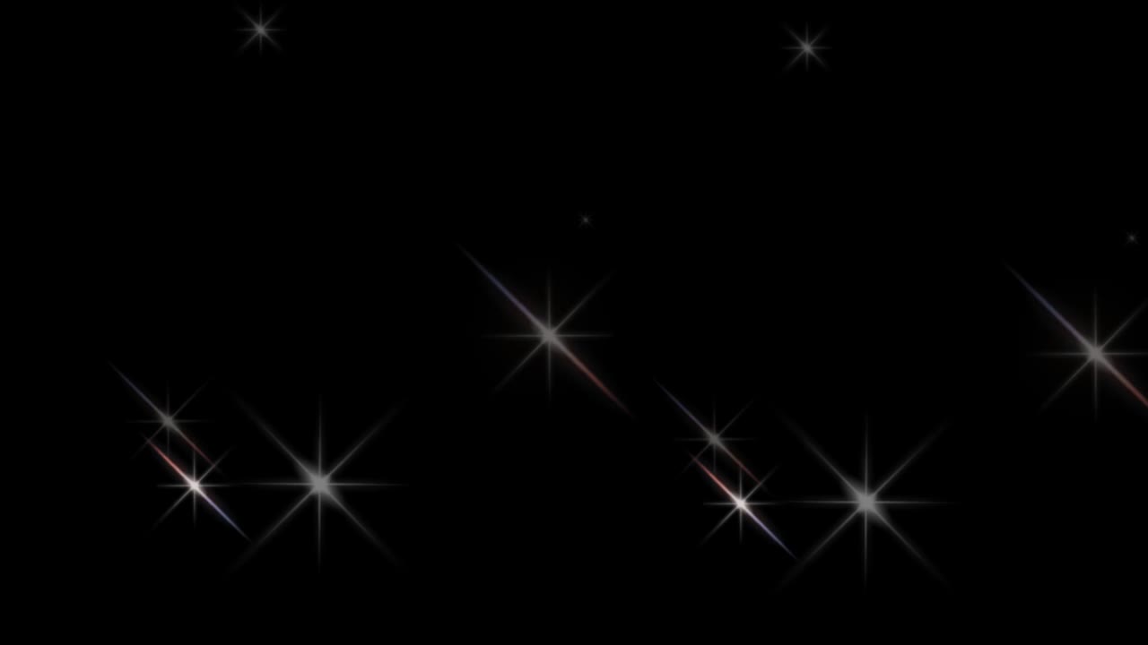 Animation white light sparkles on black background.