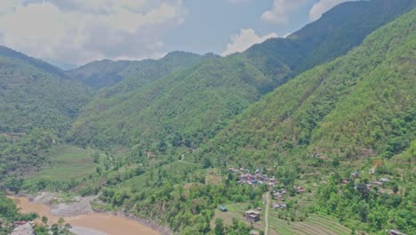 a breathtaking scene of a flowing river winding through lush green mountains, showcasing the beauty of untouched nature. ideal for travel, environment, relaxation, and scenic landscape footage
