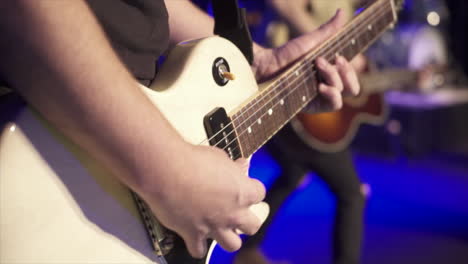 person playing guitar at a concert