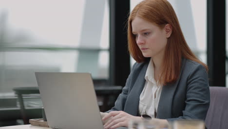 serious female lawyer is working with laptop in her office specialist of legal department in modern company