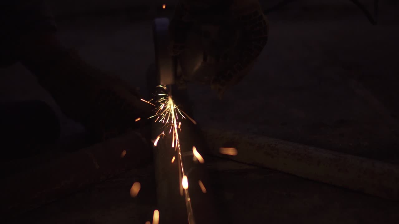 Angle grinder creates many bright sparks
