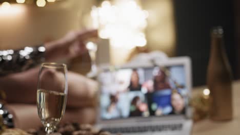 Close-up-video-of-happy-couple-toasting-during-a-video-call