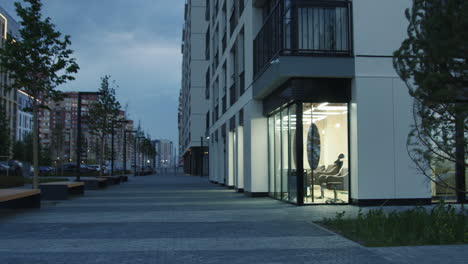 urban street scene at dusk with hair salon