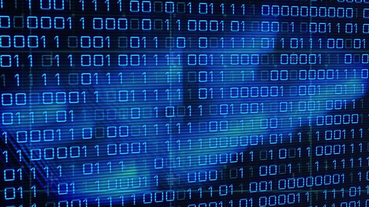 Animation of binary code over blue lines on black background