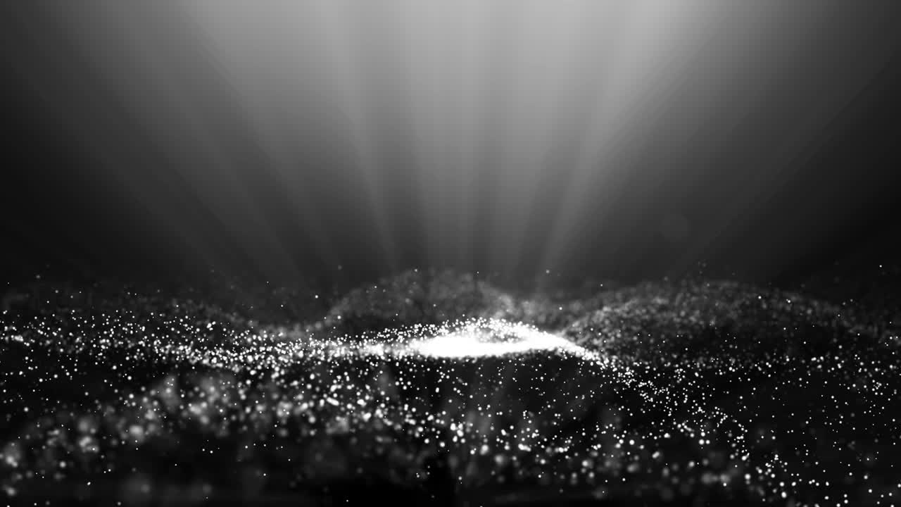 검은 배경 위에 있는 색 입자 파동