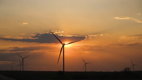 wind turbines at sunset.