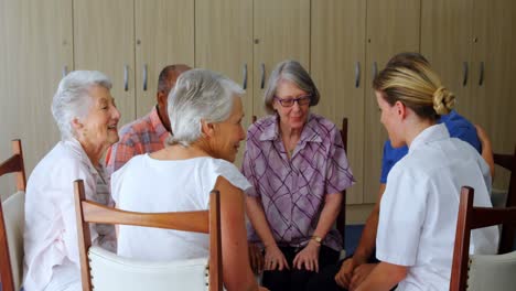 female doctor interacting with senior people 4k