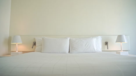 white candid and tidy double bed of hotel room