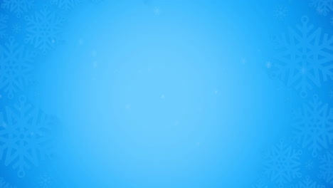 animación de copos de nieve cayendo sobre un fondo azul