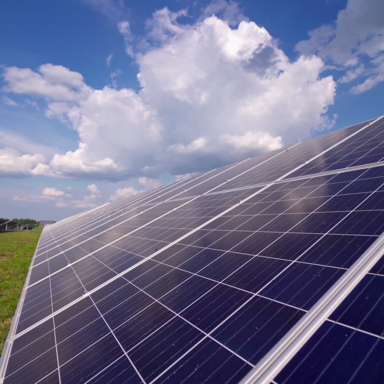 Long solar panel on field. Photovoltaic power supply system. Source of ecological renewable energy. Close-up panel.