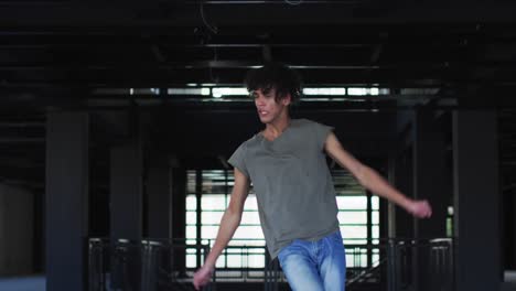 african american man dancing in empty parking garage