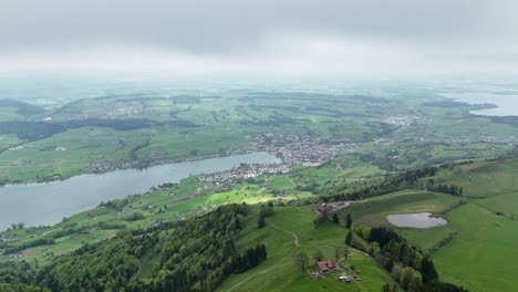 Establishing-drone-shot-of-Swiss-town-of-Küssnacht-at-Vierwaldstättersee-Lake-in-Switzerland