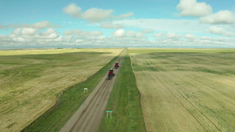 Combines-Driving-On-The-Farm-Road-On-A-Sunny-Day