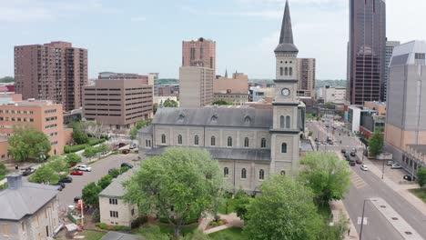 rising and panning aerial shot of a historic catholic church in saint paul, minnesota